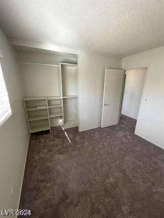 5243 Sunnywood Dr, Las Vegas, NV 89120 - unfurnished bedroom with a closet, a textured ceiling, and carpet floors