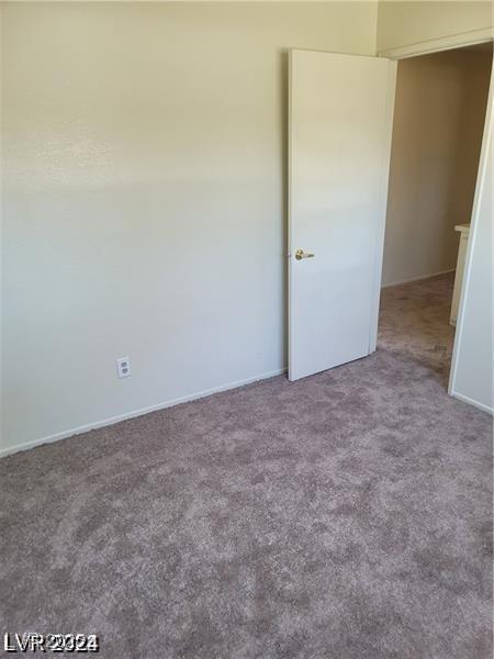 5243 Sunnywood Dr, Las Vegas, NV 89120 - unfurnished bedroom with carpet flooring