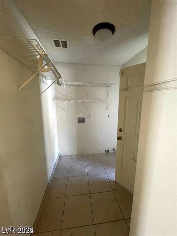 5243 Sunnywood Dr, Las Vegas, NV 89120 - spacious closet featuring tile patterned flooring