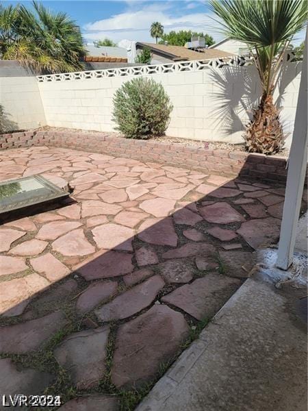 5243 Sunnywood Dr, Las Vegas, NV 89120 - fenced backyard with a patio