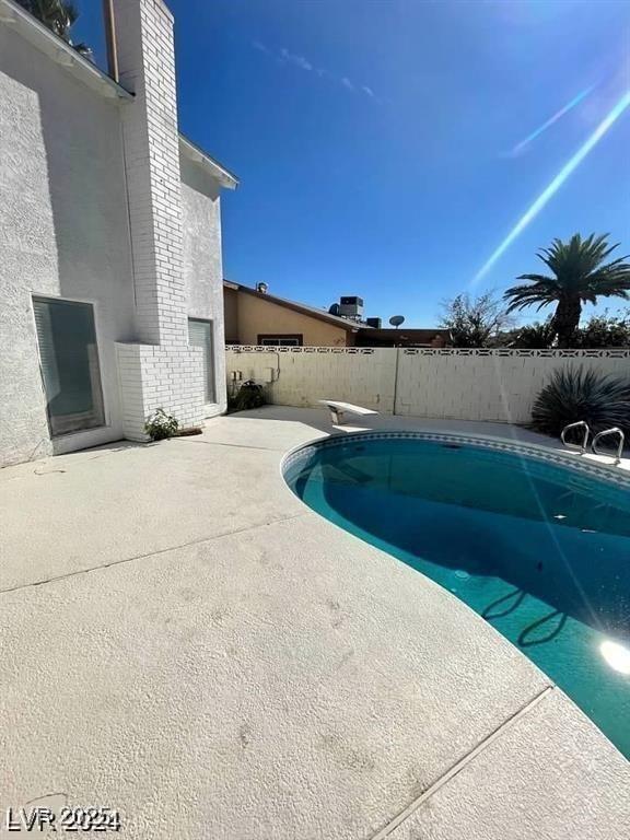 5243 Sunnywood Dr, Las Vegas, NV 89120 - view of swimming pool featuring a patio and a fenced backyard