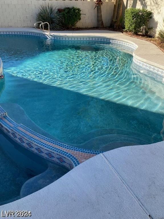 5243 Sunnywood Dr, Las Vegas, NV 89120 - view of swimming pool with a fenced backyard