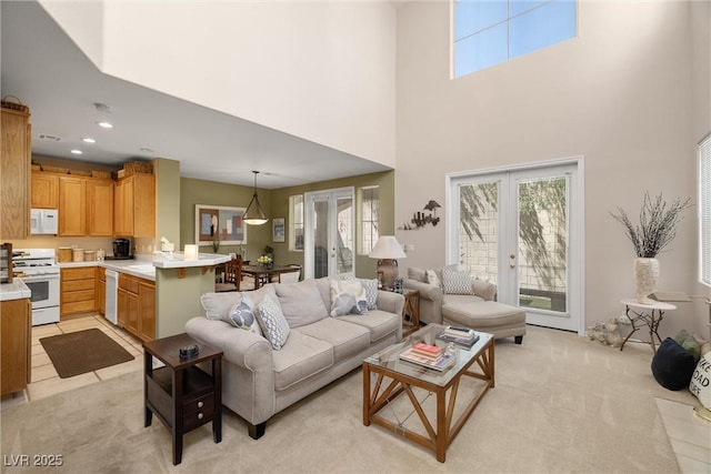 939 Paisley St, Las Vegas, NV 89145 - living area with a high ceiling, light carpet, plenty of natural light, and recessed lighting