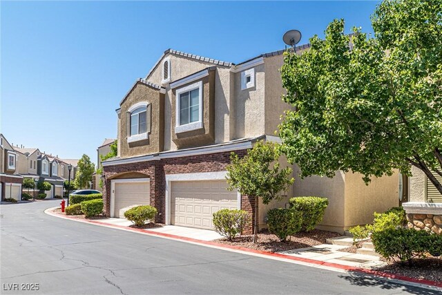 939 Paisley St, Las Vegas, NV 89145 - multi unit property featuring stucco siding, a garage, and a residential view