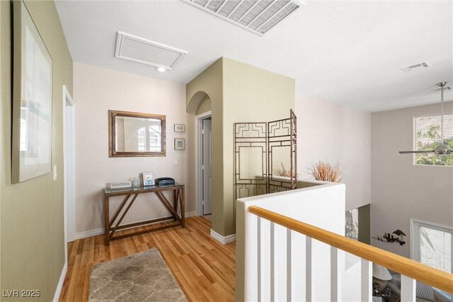939 Paisley St, Las Vegas, NV 89145 - hall featuring an upstairs landing, light wood finished floors, attic access, and baseboards