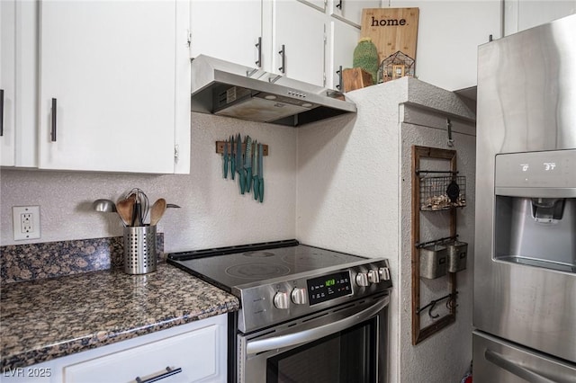 108 Verdy Ln, Las Vegas, NV 89101 - kitchen with appliances with stainless steel finishes, under cabinet range hood, white cabinetry, dark stone counters, and a textured wall