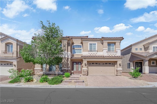 6739 Quapaw St, Las Vegas, NV 89149 - view of front facade with stucco siding, stone siding, driveway, and a tile roof