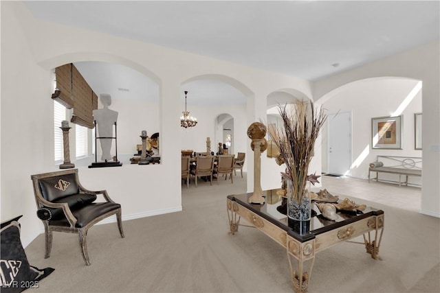 6739 Quapaw St, Las Vegas, NV 89149 - carpeted living room featuring arched walkways and a chandelier