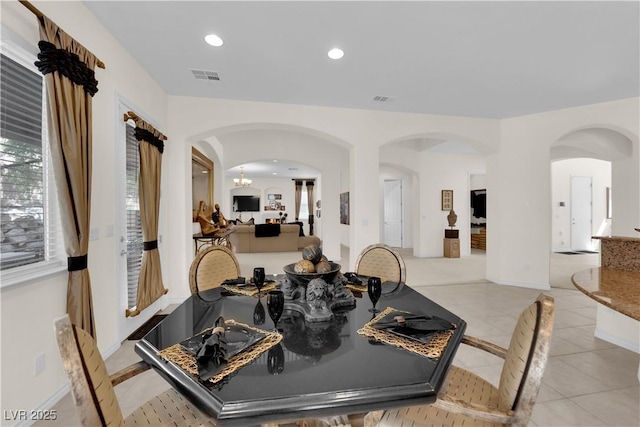 6739 Quapaw St, Las Vegas, NV 89149 - dining area with arched walkways, recessed lighting, and light tile patterned floors