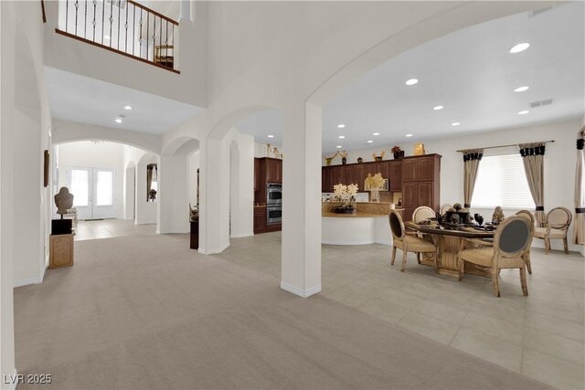 6739 Quapaw St, Las Vegas, NV 89149 - dining room featuring arched walkways, plenty of natural light, recessed lighting, and light colored carpet
