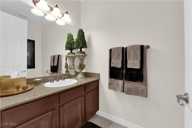 6739 Quapaw St, Las Vegas, NV 89149 - bathroom with vanity, tile patterned floors, and baseboards