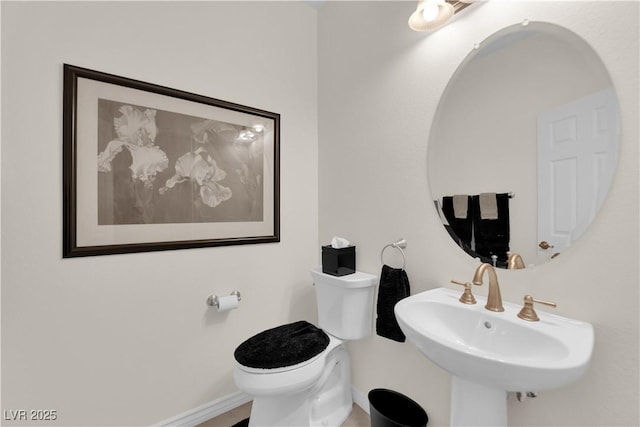 6739 Quapaw St, Las Vegas, NV 89149 - half bathroom with toilet, baseboards, and a sink