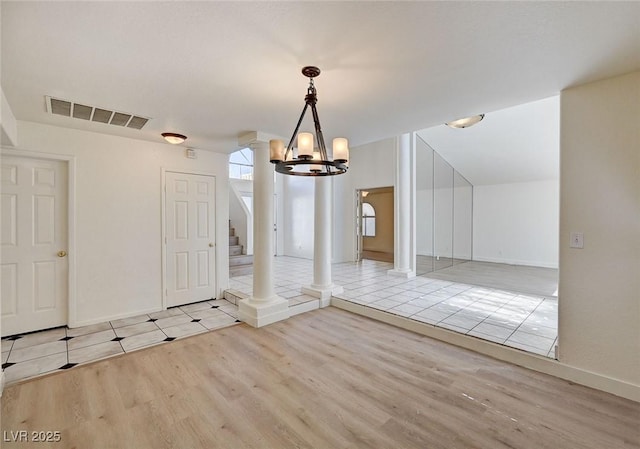 2917 Broken Willow Cir, Las Vegas, NV 89117 - unfurnished dining area with wood finished floors, a chandelier, baseboards, and stairway