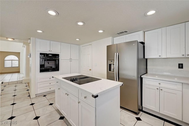 2917 Broken Willow Cir, Las Vegas, NV 89117 - kitchen with black appliances, white cabinets, light countertops, a center island, and recessed lighting