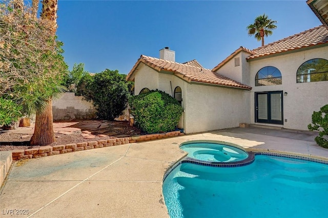 2917 Broken Willow Cir, Las Vegas, NV 89117 - view of pool featuring french doors, a patio area, and a pool with connected hot tub