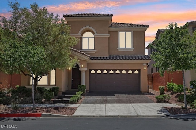 11707 Longworth Rd, Las Vegas, NV 89135 - view of front facade with a tile roof, stucco siding, driveway, and a garage