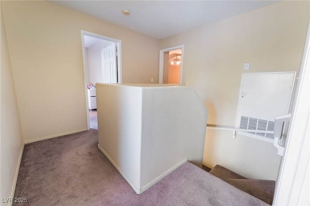 3950 S Sandhill Rd Unit 130, Las Vegas, NV 89121 - hallway featuring an upstairs landing, carpet floors, and baseboards