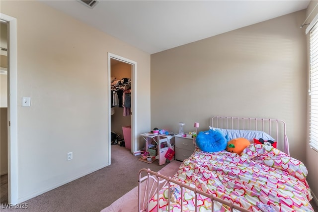 3950 S Sandhill Rd Unit 130, Las Vegas, NV 89121 - bedroom featuring carpet floors, a walk in closet, a closet, and baseboards