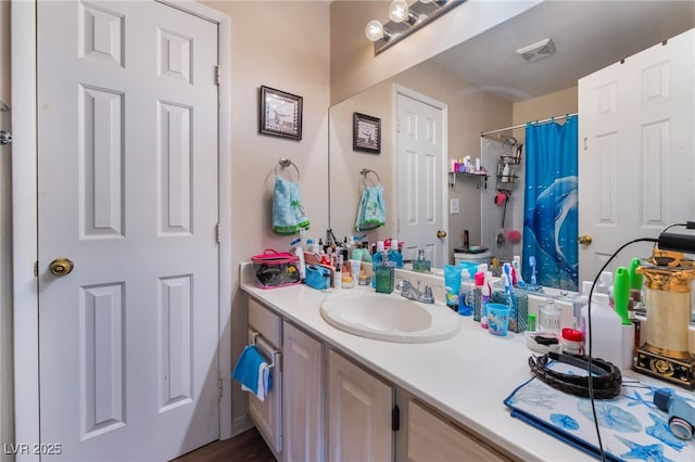 3950 S Sandhill Rd Unit 130, Las Vegas, NV 89121 - bathroom featuring vanity and a shower with curtain