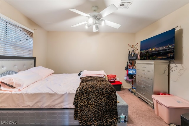 3950 S Sandhill Rd Unit 130, Las Vegas, NV 89121 - bedroom featuring light carpet and ceiling fan