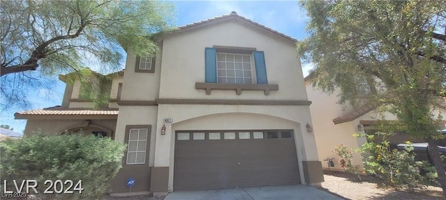 4821 Whisper Lake Ave, Las Vegas, NV 89131 - mediterranean / spanish-style house featuring a garage, stucco siding, concrete driveway, and a tiled roof