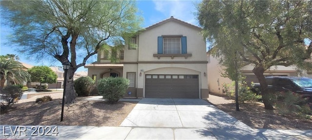 4821 Whisper Lake Ave, Las Vegas, NV 89131 - mediterranean / spanish-style home with stucco siding, concrete driveway, and an attached garage