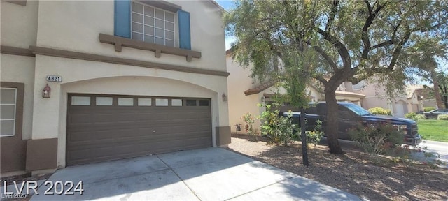 4821 Whisper Lake Ave, Las Vegas, NV 89131 - garage with concrete driveway
