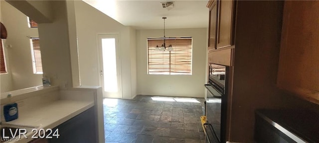4821 Whisper Lake Ave, Las Vegas, NV 89131 - unfurnished dining area featuring stone tile floors