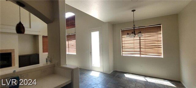 4821 Whisper Lake Ave, Las Vegas, NV 89131 - unfurnished dining area with stone tile flooring and baseboards