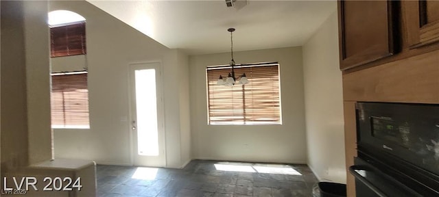4821 Whisper Lake Ave, Las Vegas, NV 89131 - unfurnished dining area with healthy amount of natural light, baseboards, and stone finish floors