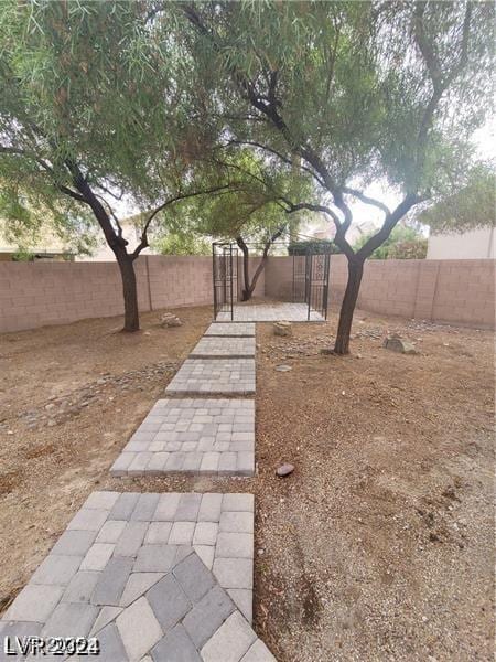 4821 Whisper Lake Ave, Las Vegas, NV 89131 - fenced backyard featuring a patio area