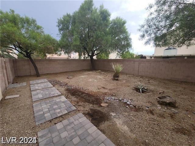 4821 Whisper Lake Ave, Las Vegas, NV 89131 - fenced backyard featuring a patio