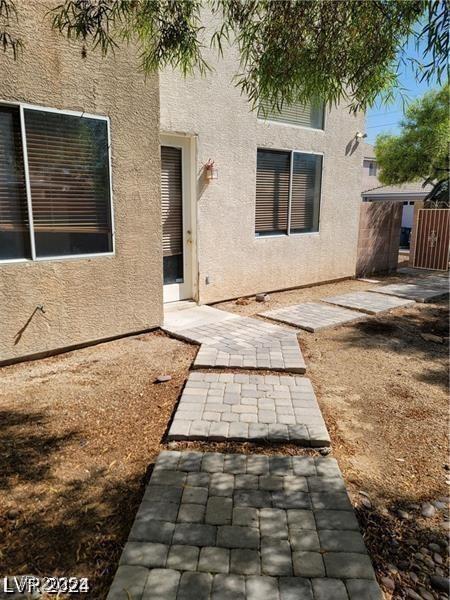4821 Whisper Lake Ave, Las Vegas, NV 89131 - rear view of house featuring stucco siding and a patio