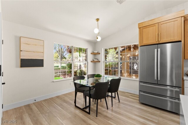 5157 Future Dr, Las Vegas, NV 89130 - dining room featuring vaulted ceiling, light wood finished floors, and baseboards