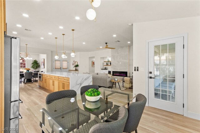 5157 Future Dr, Las Vegas, NV 89130 - dining area with light wood-style flooring and recessed lighting