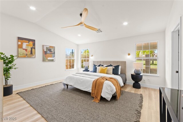 5157 Future Dr, Las Vegas, NV 89130 - bedroom with lofted ceiling, multiple windows, light wood-style flooring, ceiling fan, and recessed lighting