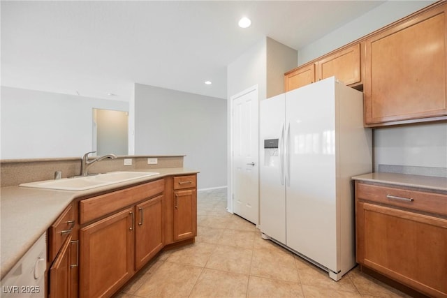 3405 Kingbird Dr, North Las Vegas, NV 89084 - kitchen with white appliances, a sink, light countertops, light tile patterned floors, and recessed lighting