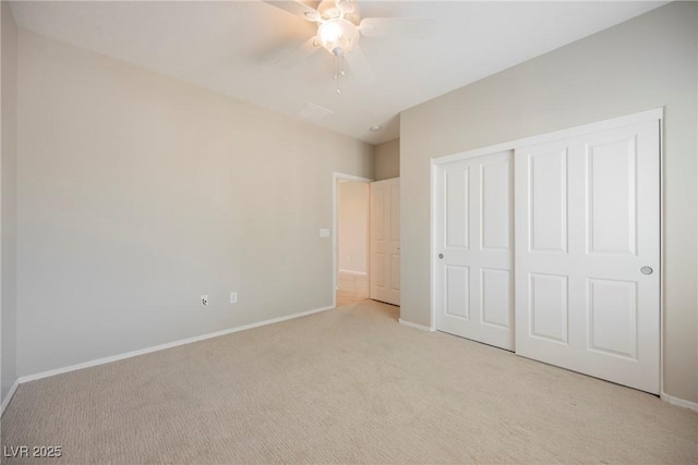 3405 Kingbird Dr, North Las Vegas, NV 89084 - unfurnished bedroom with light colored carpet, baseboards, a closet, and a ceiling fan