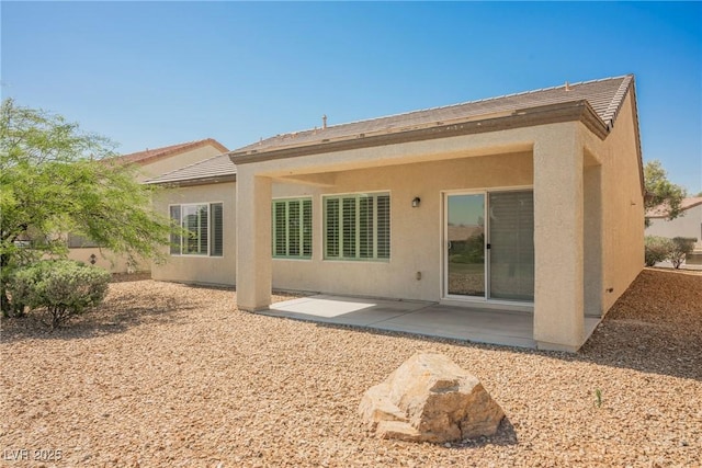 3405 Kingbird Dr, North Las Vegas, NV 89084 - back of house featuring a patio and stucco siding