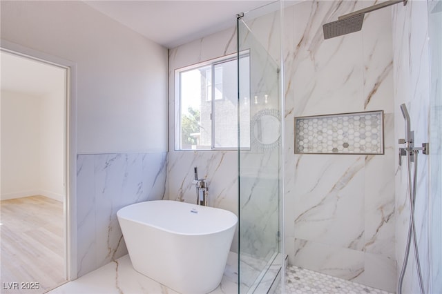 5653 Artesia Lake Ct, Las Vegas, NV 89118 - bathroom with a marble finish shower, tile walls, and a soaking tub