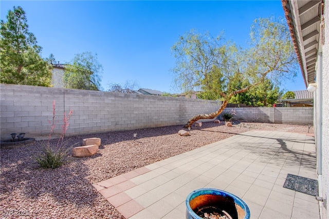 5653 Artesia Lake Ct, Las Vegas, NV 89118 - fenced backyard with a patio