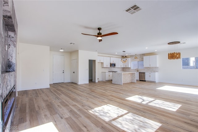 5653 Artesia Lake Ct, Las Vegas, NV 89118 - unfurnished living room featuring light wood-style floors, ceiling fan, baseboards, and recessed lighting