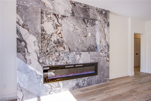 5653 Artesia Lake Ct, Las Vegas, NV 89118 - detailed view of wood finished floors and a high end fireplace