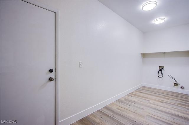 5653 Artesia Lake Ct, Las Vegas, NV 89118 - laundry area with washer hookup, wood finished floors, baseboards, and gas dryer hookup