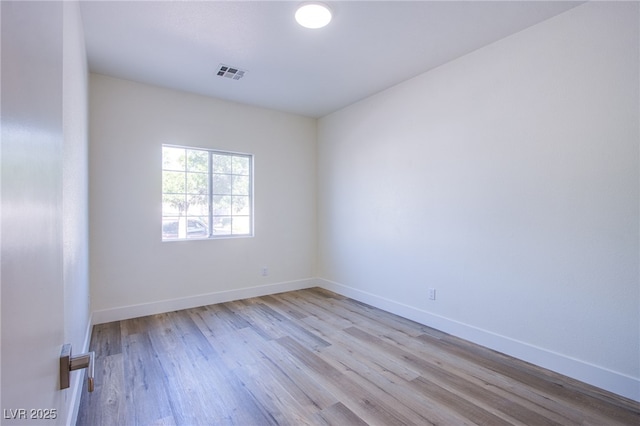5653 Artesia Lake Ct, Las Vegas, NV 89118 - unfurnished room featuring wood finished floors and baseboards