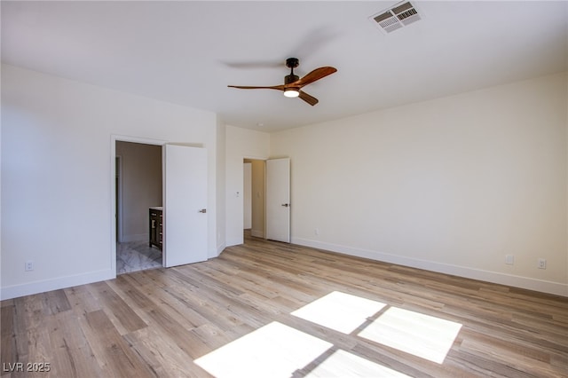 5653 Artesia Lake Ct, Las Vegas, NV 89118 - empty room with light wood-type flooring, a ceiling fan, and baseboards