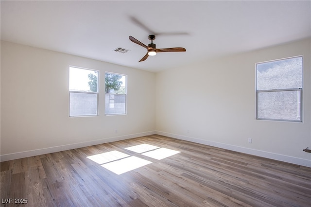 5653 Artesia Lake Ct, Las Vegas, NV 89118 - spare room with baseboards, wood finished floors, and ceiling fan
