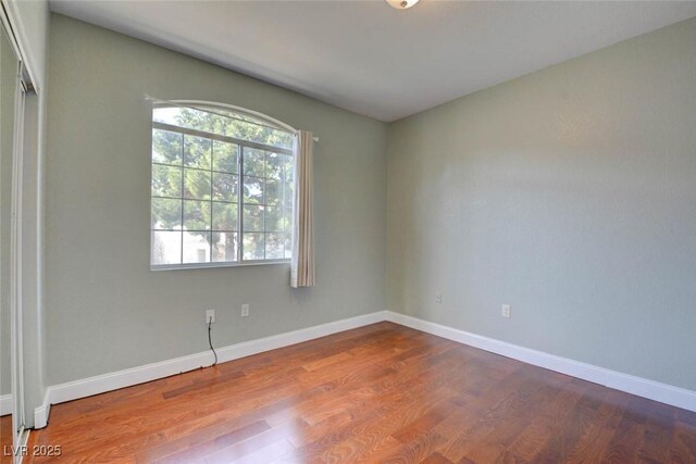 1405 S Nellis Blvd Unit 2117, Las Vegas, NV 89104 - empty room with dark wood finished floors and baseboards