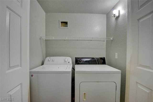 1405 S Nellis Blvd Unit 2117, Las Vegas, NV 89104 - washroom featuring washing machine and clothes dryer and a textured wall