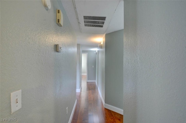 1405 S Nellis Blvd Unit 2117, Las Vegas, NV 89104 - hall featuring wood finished floors, a textured wall, and baseboards